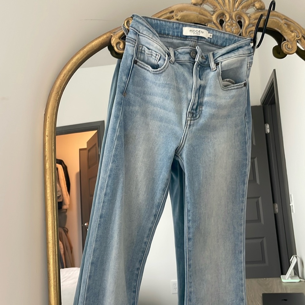 Boutique jeans. Slight flare with slit hem.